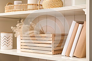 White shelving unit with books and decorative stuff