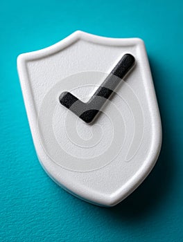 White shield with checkmark on teal background.
