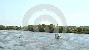 White ship with tourists floating on Volkhov river