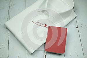 A white shirt with an empty red label