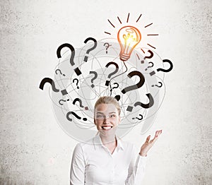 White shirt girl and light bulb with question marks