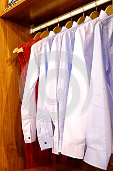 White shirts hanging in wardrobe, adobe rgb photo