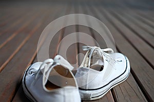 White shoe on wood background