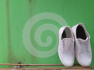 white shoes and green walls photo