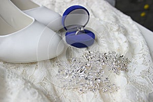 White shoes. wedding shoes. Bride`s high heels. The fees of the bride. Wedding jewelry.