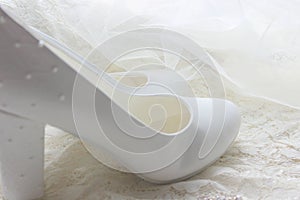 White shoes. wedding shoes. Bride`s high heels. The fees of the bride. Wedding jewelry.