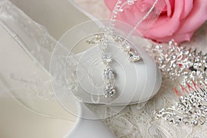 White shoes. wedding shoes. Bride`s high heels. The fees of the bride. Wedding jewelry.