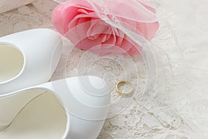 White shoes. wedding shoes. Bride`s high heels. The fees of the bride. Wedding jewelry.