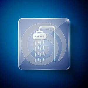 White Shower head with water drops flowing icon isolated on blue background. Square glass panels. Vector