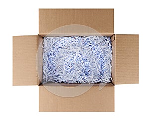 White shredding paper in cardboard crate isolated on white background with clipping path