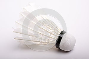 White shuttlecock on white-gray background