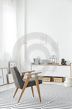 White sideboard in stylish interior