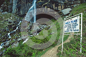 White sign on background jogini waterfall