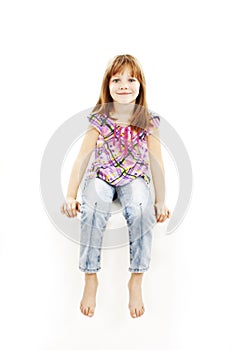 White sign little girl sitting on billboard