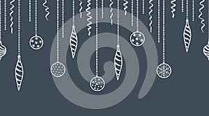 White silhouettes of Christmas tree decorations on dark blue background. Seamless holiday border. Ornaments and serpentine