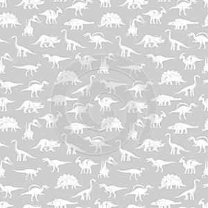 White silhouettes different dinosaurus vector seamless pattern