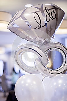 White and silver mylar engagement balloon that says, photo