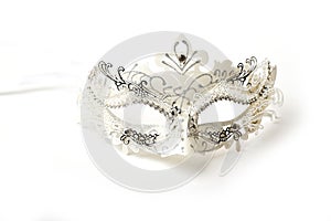 White and Silver Ornate Masquerade Mask on White Background