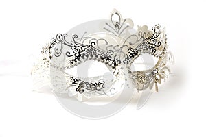 White and Silver Ornate Masquerade Mask on White Background