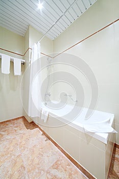 White simple clean bath in light and empty bathroom