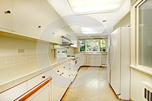 White simple old kitchen interior in American historical house.