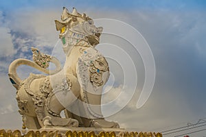 White Singha statue on temple gate of Wat Jedyod, Chiang Rai, Thailand. Wat Chet Yot is a temple that has been renovated from the