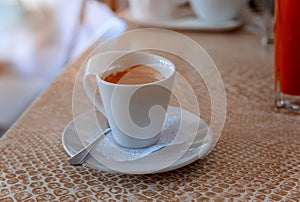 White single cup of coffee espresso on the table