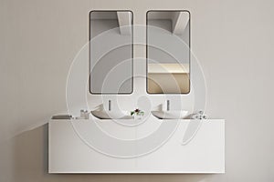 White sink vanity unit in a white bathroom