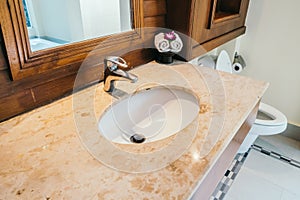 White sink and water facuet decoration in barhroom