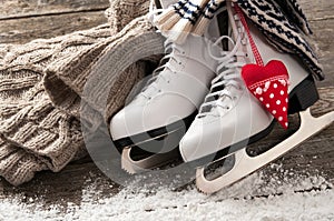 White skates on old wooden boards