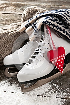 White skates on old wooden boards