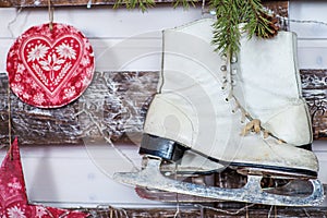 White skates on a wooden wall