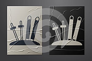 White Ski and sticks icon isolated on crumpled paper background. Extreme sport. Skiing equipment. Winter sports icon