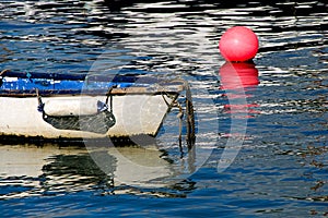 White Skiff With Pink Buoy