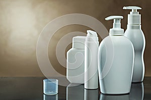 White skincare sprayers and tubes on vintage background