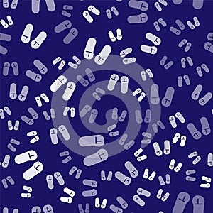 White Slipper icon isolated seamless pattern on blue background. Flip flops sign. Vector Illustration