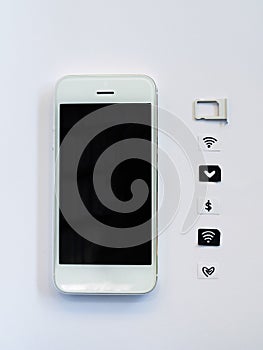 A white smart phone, sim card tray and small paper simulated as