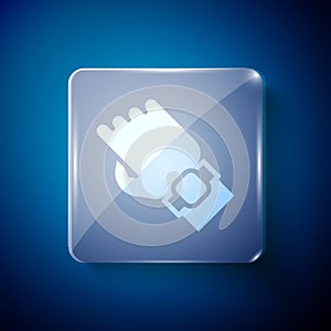 White Smart watch on hand icon isolated on blue background. Fitness App concept. Square glass panels. Vector