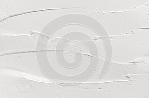 White smeared plaster texture. Lightweight modern abstract background.