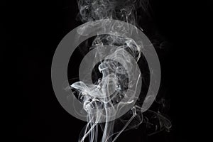 White smoke on black background