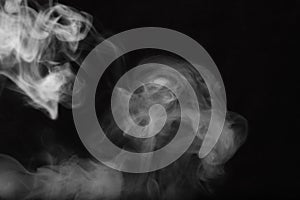 White smoke on a black background. Texture of smoke. Clubs of wh