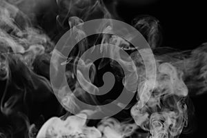 White smoke on a black background. Texture of smoke. Clubs of wh