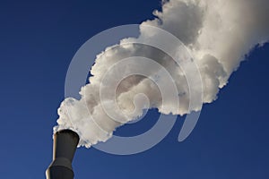 White smoke coming out of industrial chimney