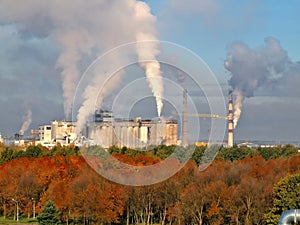 White smoke coming out of industrial chimney