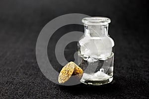 White smoke inside glass bottle at black background, Mistery hal