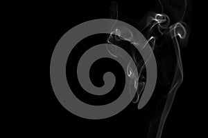 White smoke isolated on black background. Flow smoke or fog effect for montage.
