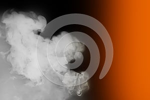 White smoke smoker cloud from hookah on black background with orange color light