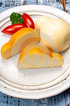 White and smoked yellow italian scamorza cheese