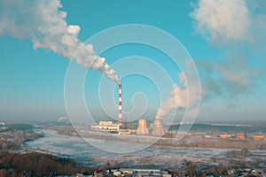 White Smokestack pollution from Coal and Lignite burning at Thermal Heating Plant near the city.