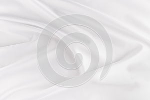 White smooth elegant silk or satin fabric texture with liquid wave.